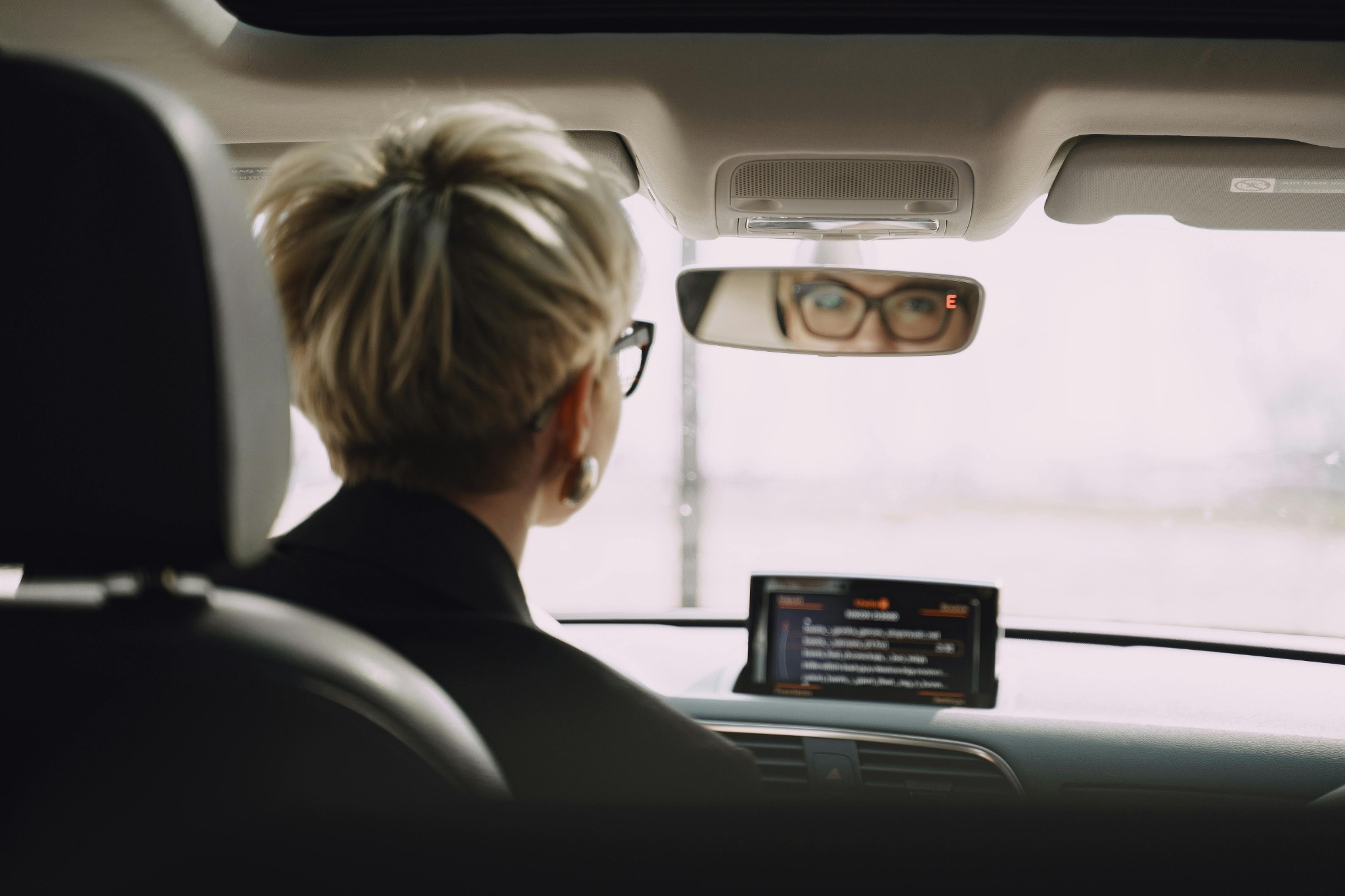 Woman driving in the UK wearing glasses